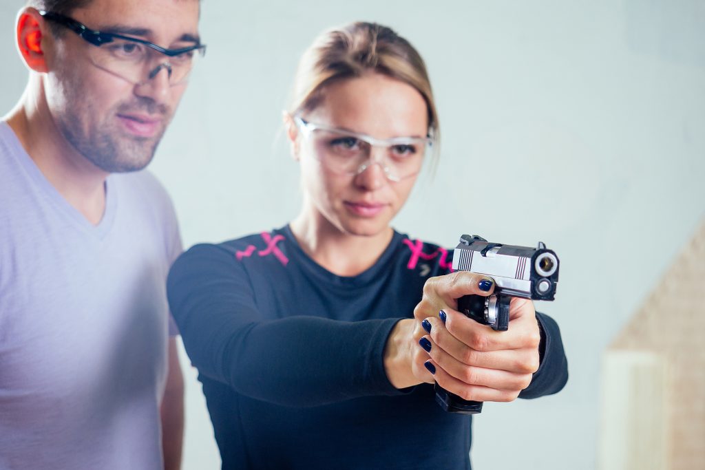 Woman gun range training practice