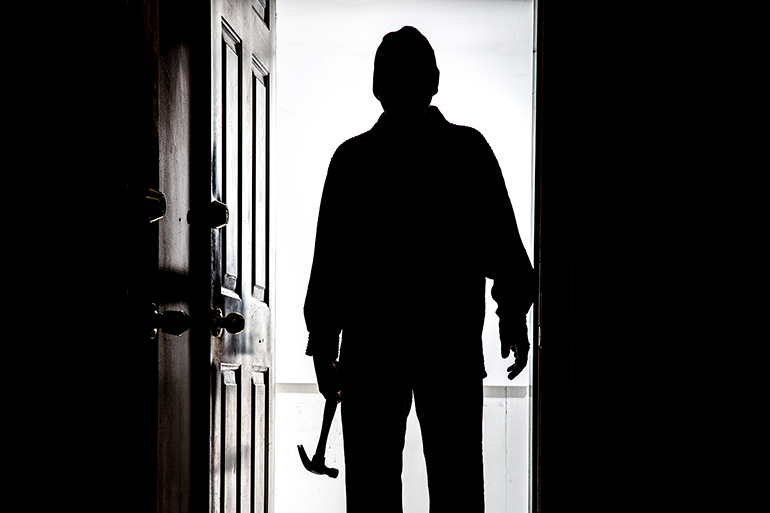 Intruder home invasion burglar hammer night dark