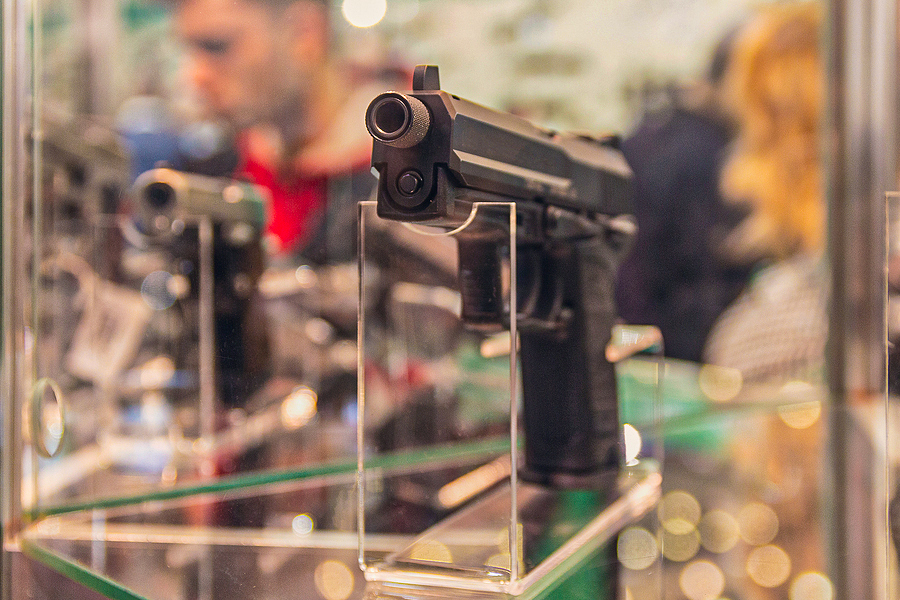 gun counter store pistol Bigstock