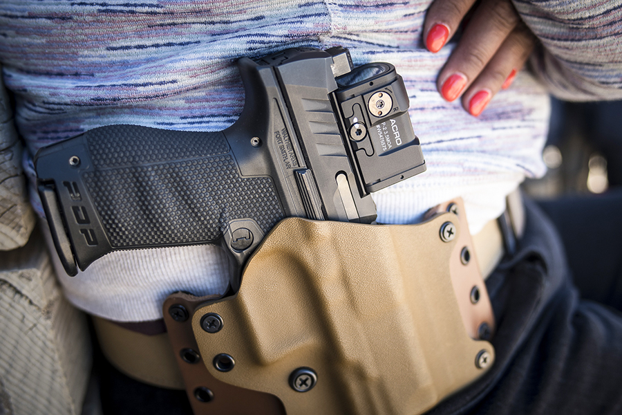 Gunsite range train Aimpoint ACRO P-2 red dot pistol in holster