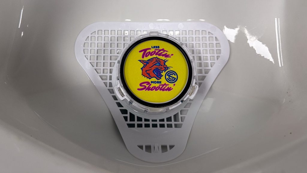 SilencerCo urinal ad at NRAAM