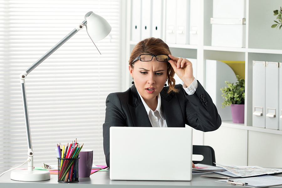 woman fake news laptop bigstock