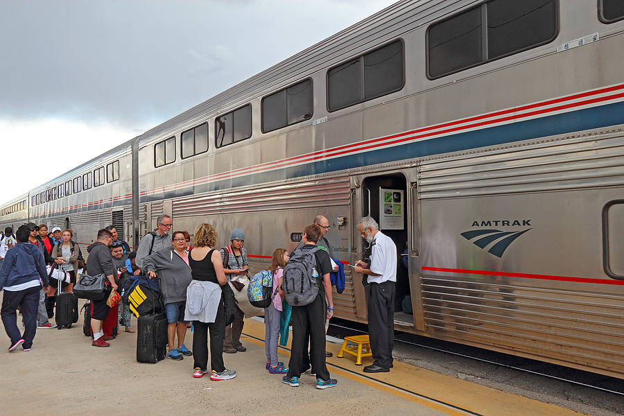 Amtrak train passengers boarding Bigstock