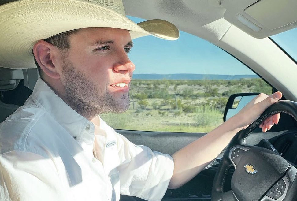 talarico in a pickup truck with cowboy hat