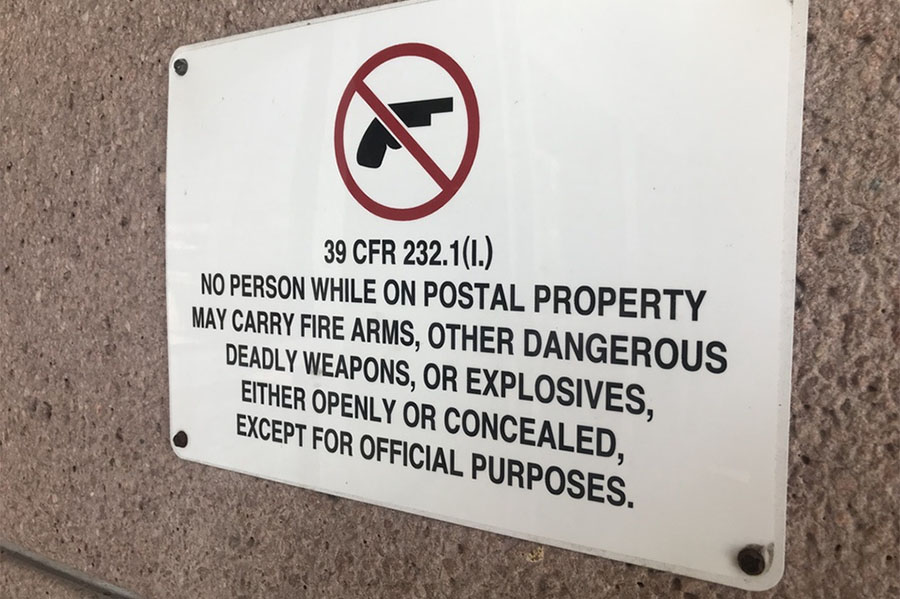 usps post office no guns sign
