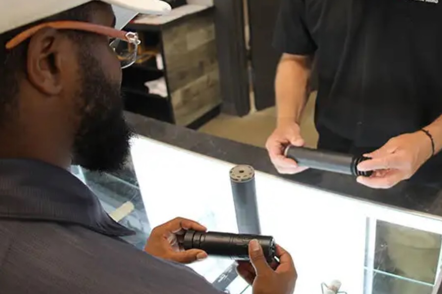 buying suppressor silencer gun store counter