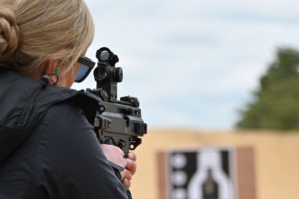 woman women gun owner shooting range train